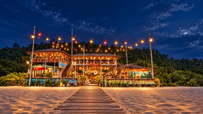 Sea Mount two-storey restaurant at night with planted walkway