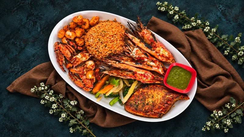 Seafood platter with grilled prawns, crab, fish and rice